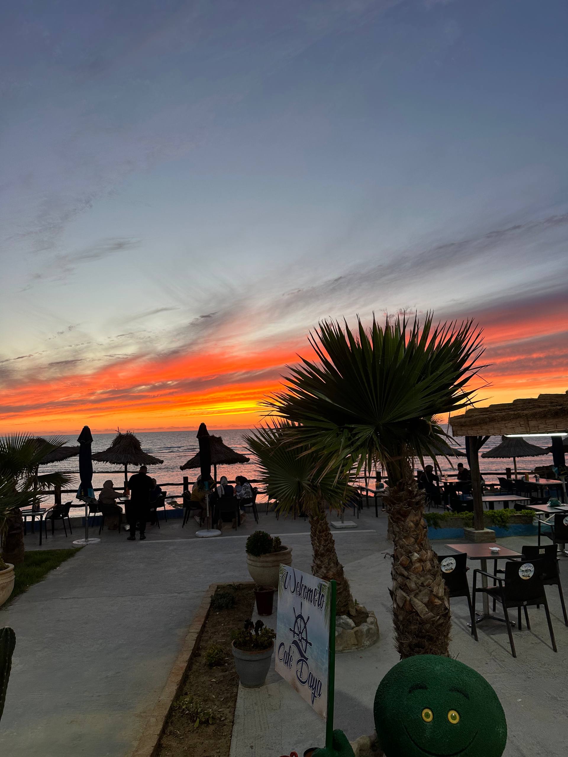 Cafe Daya seaside terrace at sunset